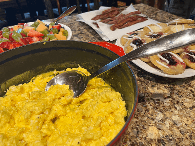 The complete breakfast, including eggs, bacon, fruit and of course the danishes