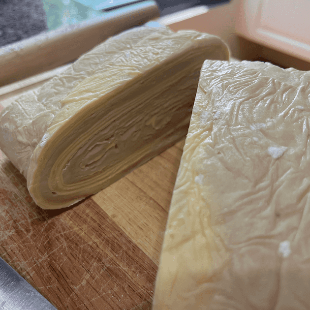 Cut away of pastry dough, showing around 54 layers of butter and dough